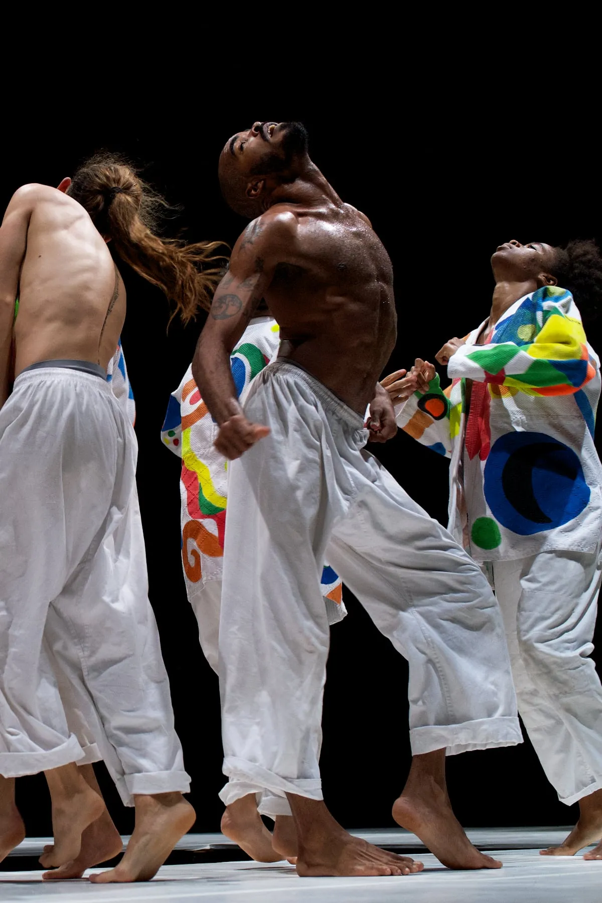 cuban dancers wearing colorful kimonos performing brutal