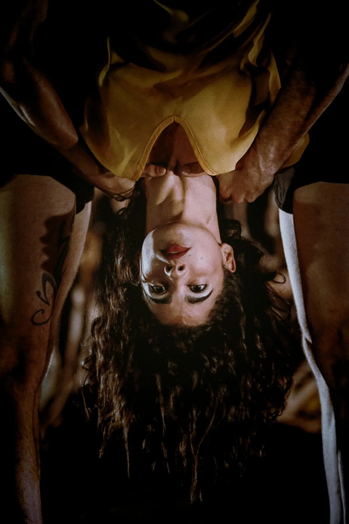 two dancers legs and a female dancer upsidedown 